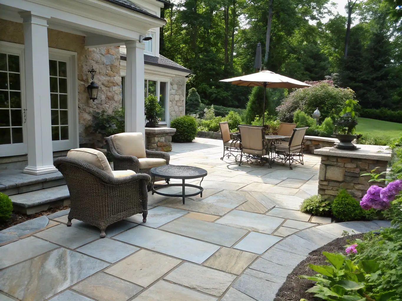 A beautifully designed patio in a backyard in Cumberland County, Nova Scotia, showcasing the company's hardscaping expertise.